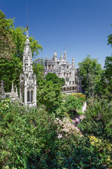 Fototapeta na wymiar Astonising white castle in magnificent green park