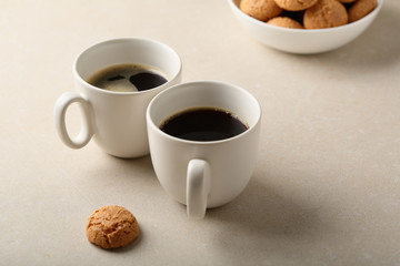 Hot espresso coffee white cups and cookies