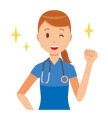 A female nurse wearing a blue scrub is raising his fist