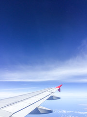 Fototapeta premium Morning blue sky with Wing of an airplane.