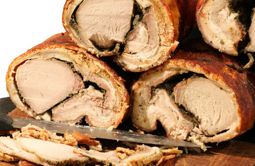 cooked pork meat called PORCHETTA in Italian for sale in the str