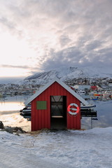 Red fishing hut in the harbor-Lodingsaksla mounts background. Lodingen-Hinnoya-Lofoten-Norway. 0667