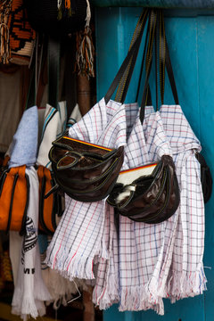 Colombian traditional leather satchel from the Antioquia Region called Carriel and poncho