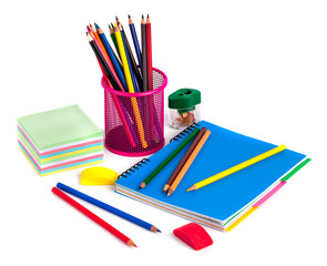colored pencils in the basket, Eraser and pencil sharpener on white background