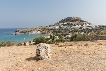 Acropolis, the second largest and most significant in Greece, and white houses in Lindos on the...