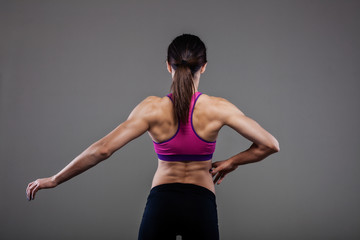 Fototapeta na wymiar muscular back of a fitness girl