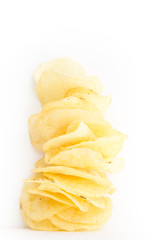 Naklejka na ściany i meble Crispy thinly sliced potato chips, on white background.