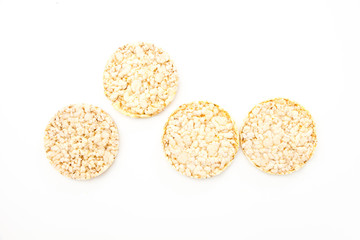Round corn cakes/ crackers, on white background.