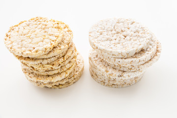 Round rice and corn cakes/ crackers, on white background.