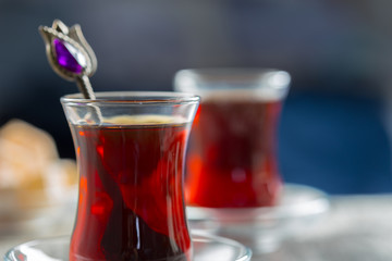 Red tea in turkish glasses on a wooden table