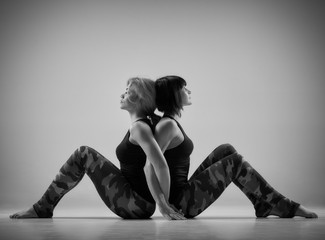 Fototapeta na wymiar Yoga exercise in pair