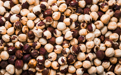 Roasted hazelnuts close-up top view. Background, texture.