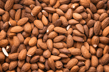 Almonds close-up top view. Background, texture.