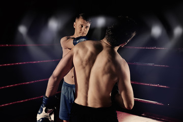 Fototapeta na wymiar Young professional boxers training in ring