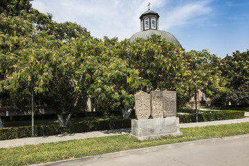 Obraz premium Stone cross in Echmiadzin (Vagharshapat) made of red stone tufa. ,