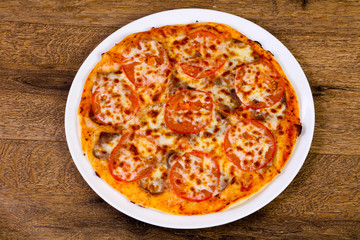 Pizza with beef and tomato