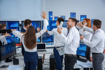 Stock traders working in office