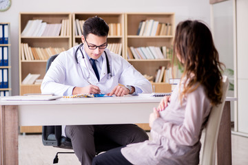 Pregnant woman visiting doctor for consultation