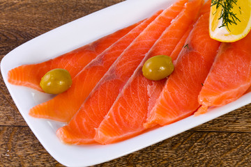 Sliced salmon with lemon