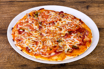 Pizza with sausages and tomato