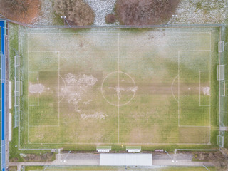 Aerial view of soccer field in winter with snow