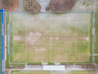 Aerial view of soccer field in winter with snow