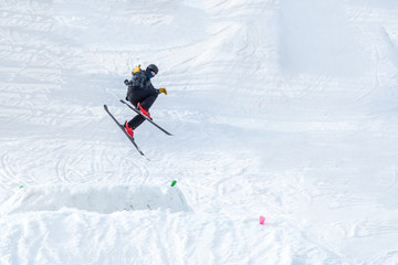 People are having fun in downhill skiing and snowboarding