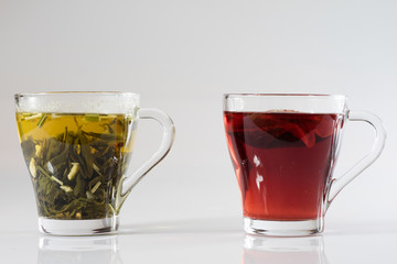 Tea in a glass on a white background. Green or fruit tea.