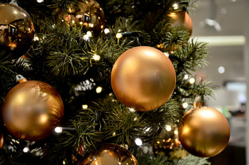 Obraz na płótnie Canvas Close-up image with Gold Christmas Balls on tree