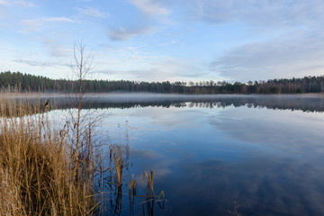 lake with water reflections in colorful autumn day