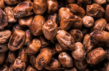 Dates close-up top view. Background, texture.