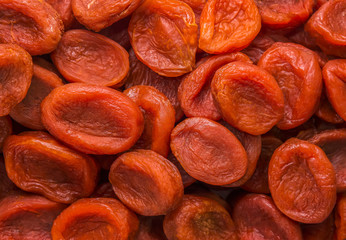 Dried apricots close-up top view. Background, texture.
