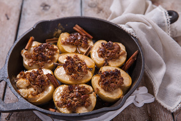 Baked apple with nuts, honey and oat flakes