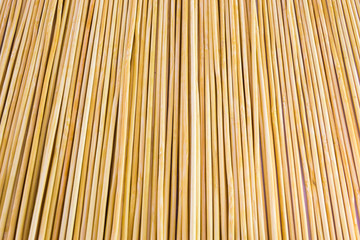 Wooden yellow bamboo mat texture abstract background.