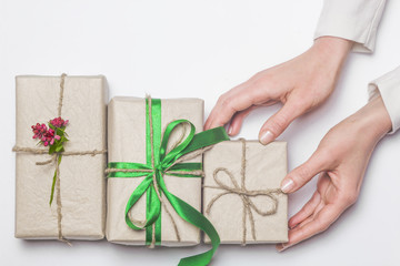 Gifts for the holiday. Hands take the box.