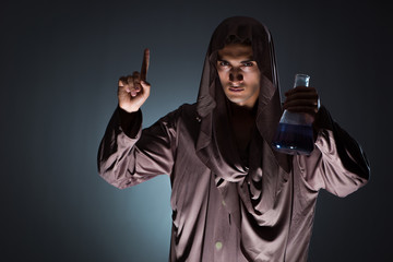 Alchemist doing experiments in alchemy concept