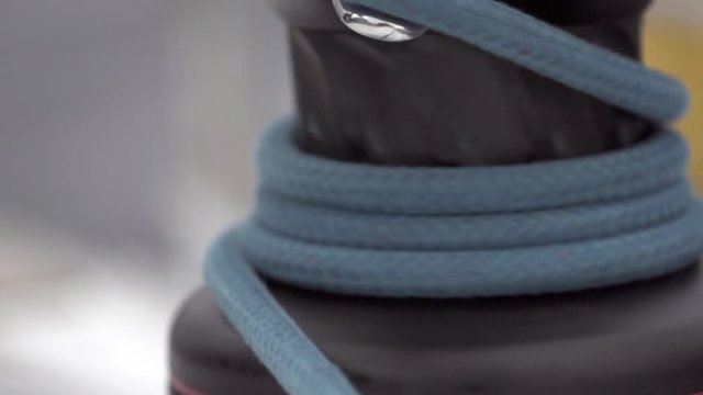 Cable winch close up slow motion. Detail of marine equipment on sailing vessel.
