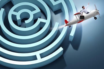 Businessman escaping from maze on airplane © Elnur