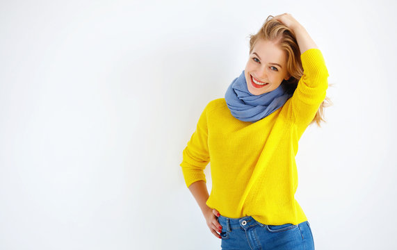 Ppy Young Woman In Yellow Sweater On White Background.