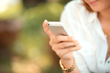 Woman hand using smart phone