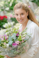 Lady holding large bouquet of flowers
