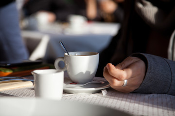 woman drinking caffe latte on terrace