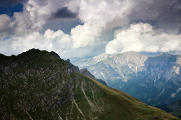 stormy clouds over alpine peaks in summer