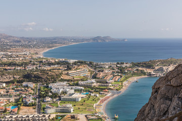 Fototapeta premium Stony landscape of Tsambika mountain and a view of Kolymbia, a small resort on the Rhodes Island, Greece. 