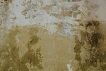 Grungy dirty wall texture. Damaged plaster with  water stains on the surface