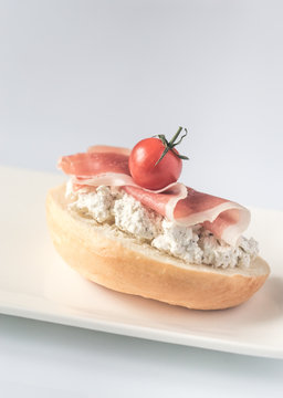 Toast with robiola and prosciutto