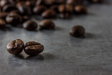 Coffee beans on gray concrete background