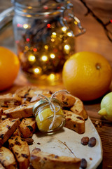 Cookie biscotti, a jar of honey and fruit. The atmosphere of warmth and coziness. New year atmosphere