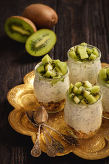 Yogurt with chia seeds, muesli and kiwi fruit.
