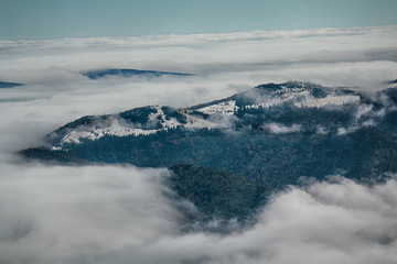 Snow-capped mountains among the clouds. Carpathians, Ukraine